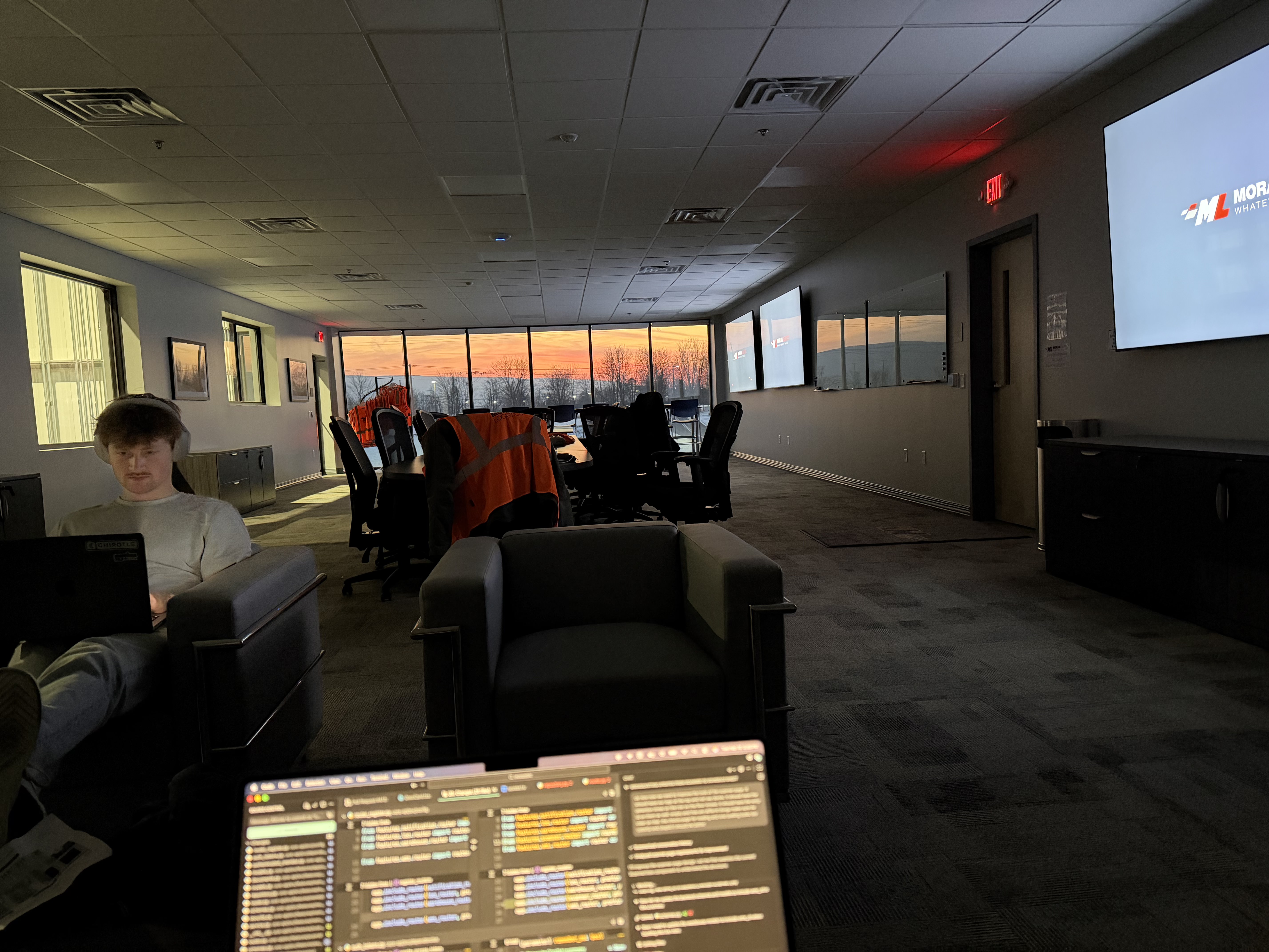 The team working from the warehouse office at sunset