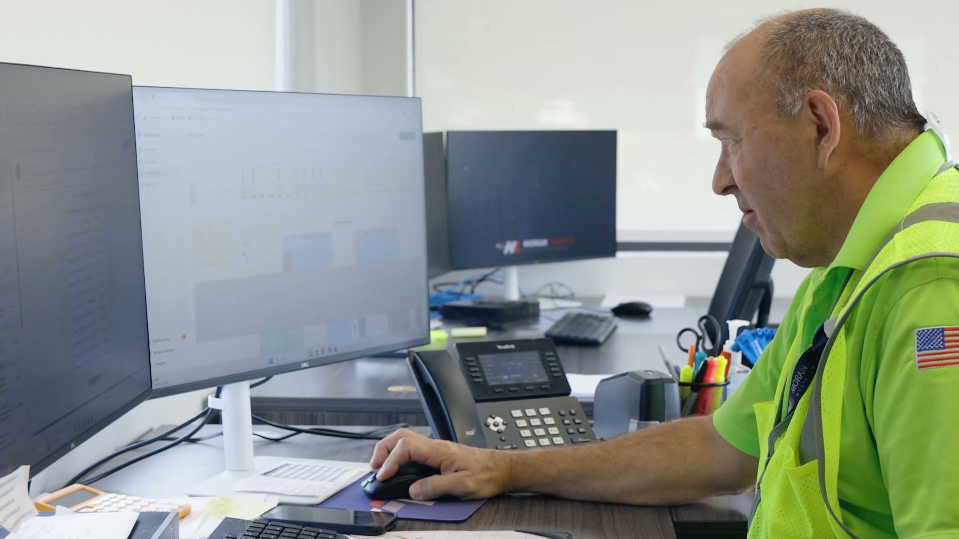 A gate operator working from a fixed terminal at a warehouse entrance
